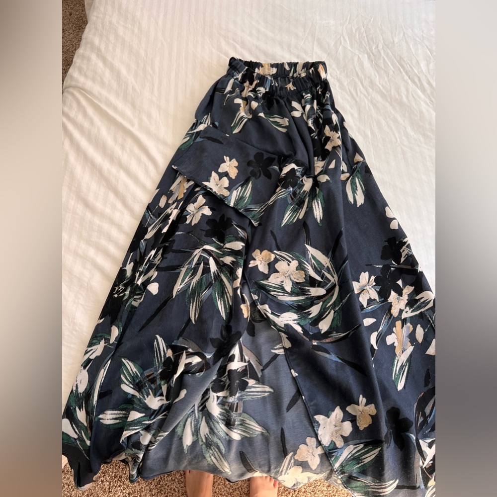 Long silky skirt with a cut in the middle for a sexy leg show.